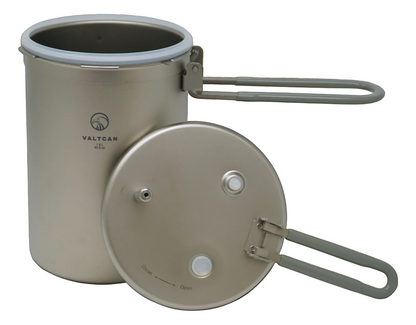 Metal camping pot with lid on a white background